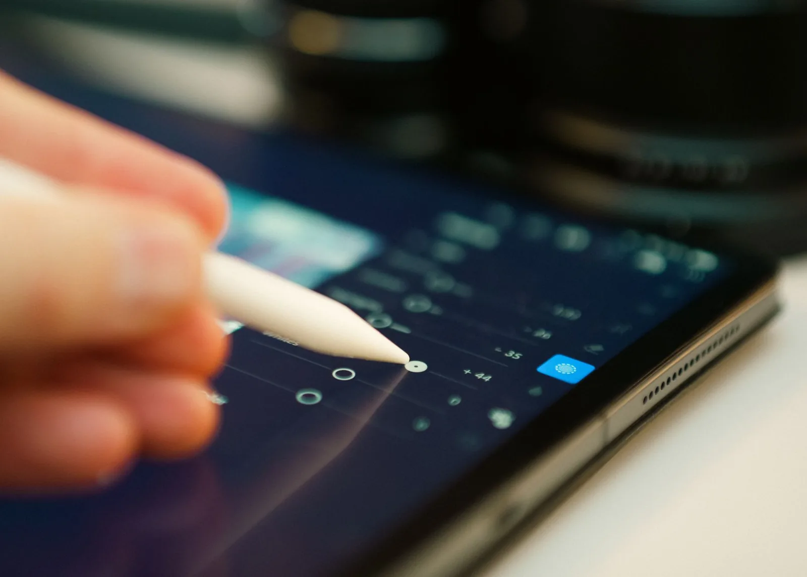 A stylus editing a software interface on a tablet screen