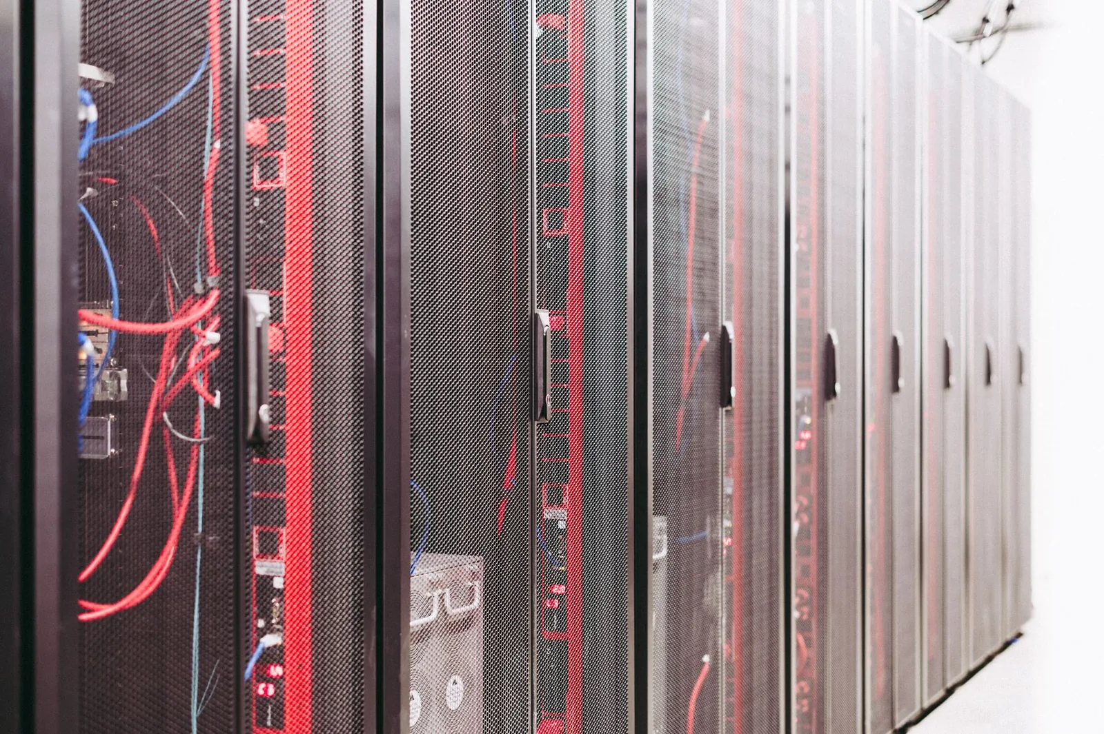 Rows of server racks and structured cabling inside a data centre
