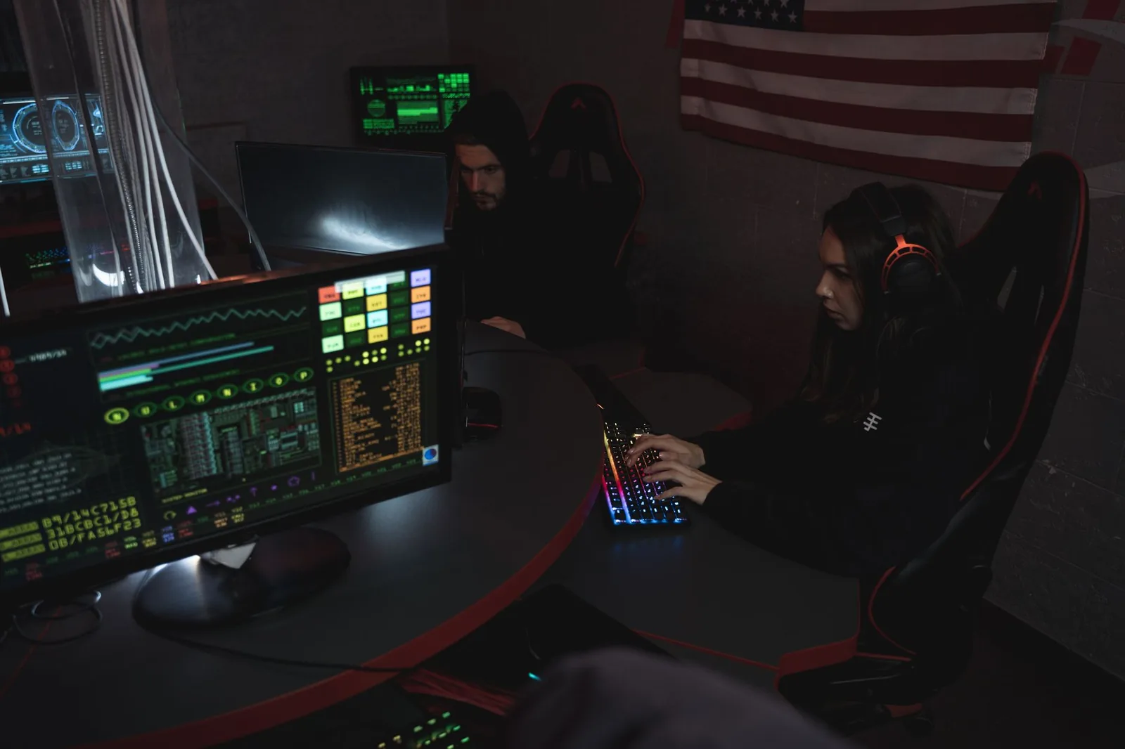 Analysts monitoring multiple screens in a security operations centre